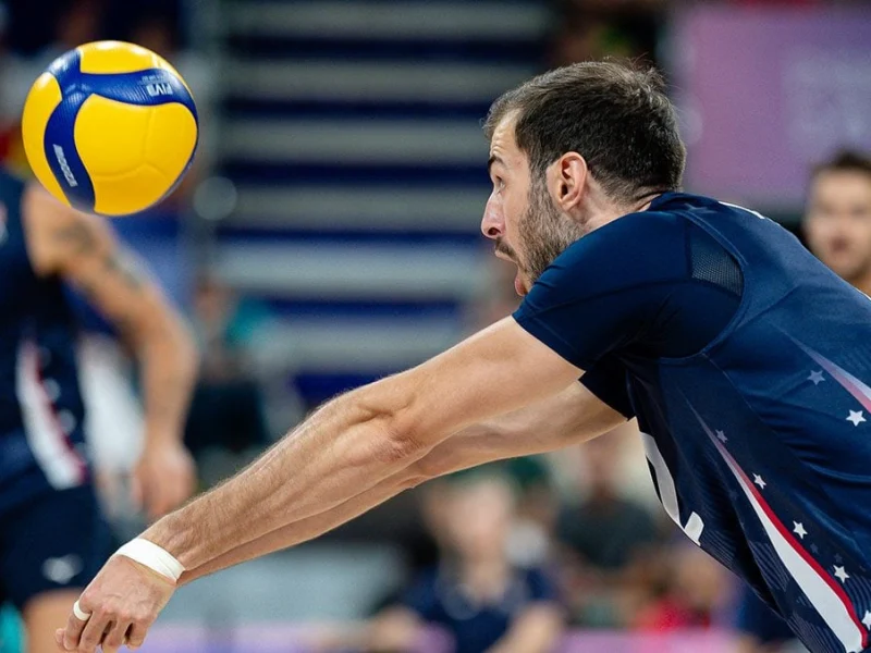 Aaron Russell passing for the United States against Poland at the Paris 2024 Olympic Games.