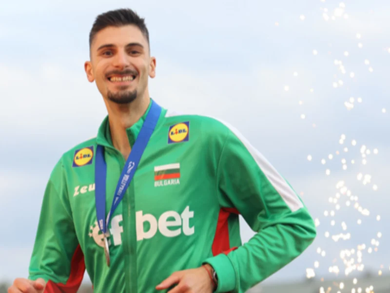 Aleks Grozdanov wearing a Bulgaria tracksuit and medal after a major international achievement