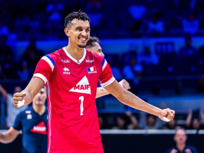 Barthélémy Chinenyeze celebrates a point in France national team colors.