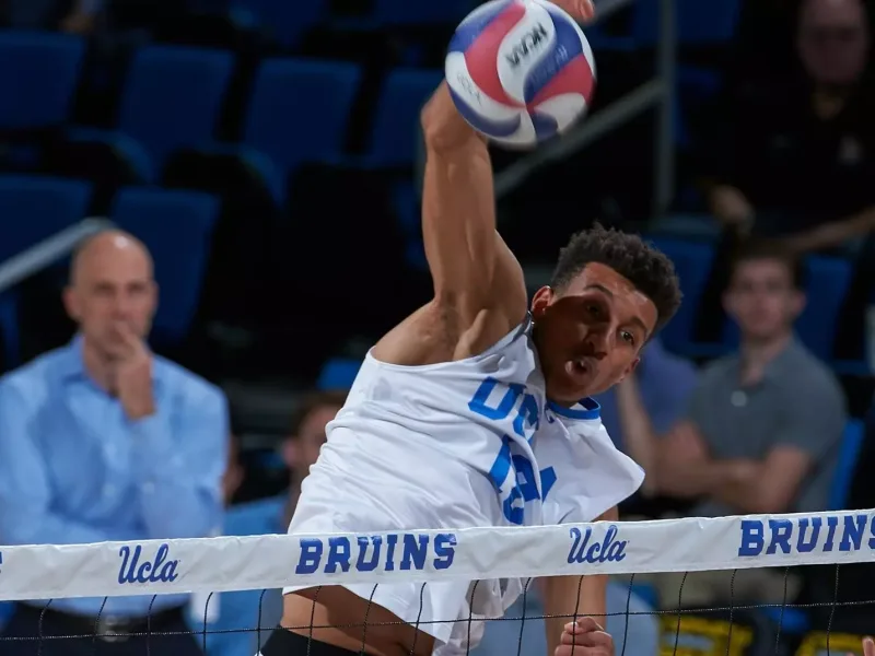 Daenan Gyimah attacking above the net for UCLA.