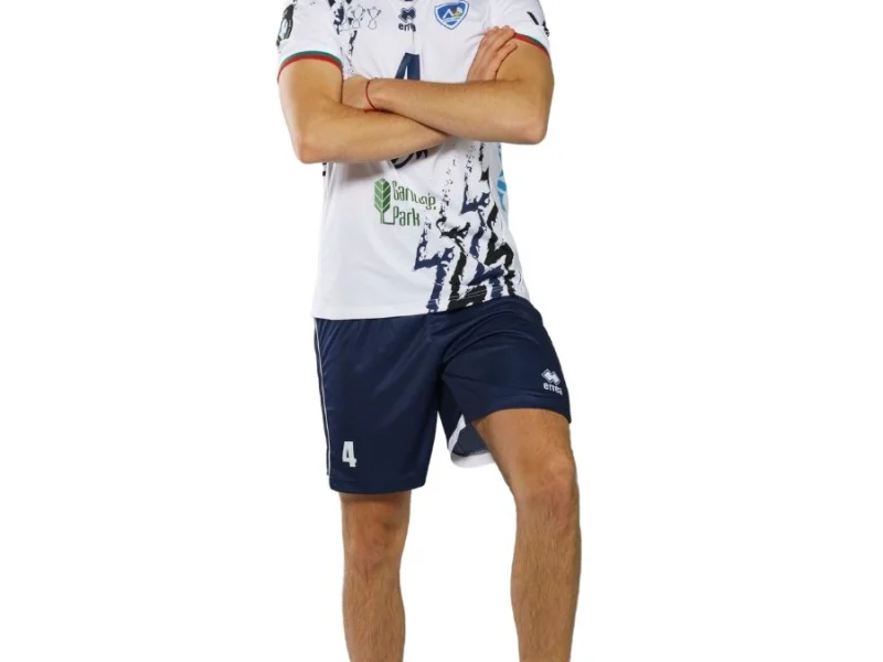 Dimitar Dobrev posing in VC Levski Sofia kit with a volleyball