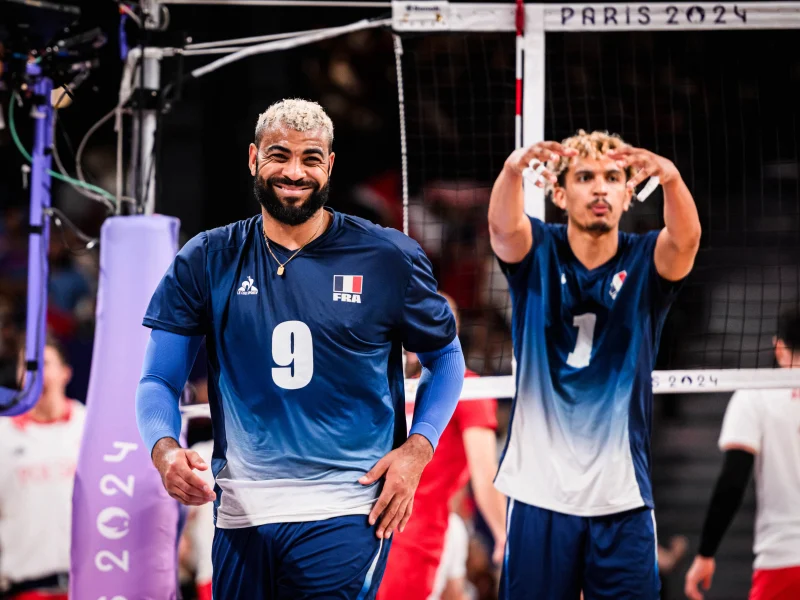 Earvin Ngapeth smiles in France colors during the Paris 2024 Olympic volleyball tournament.