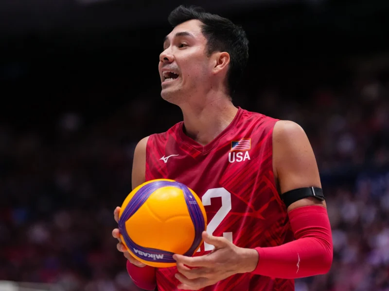Erik Shoji holding the ball for the United States men's national volleyball team.