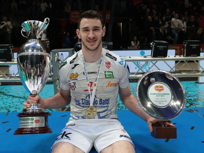 Fabio Balaso holding the Coppa Italia trophy with Cucine Lube Civitanova.