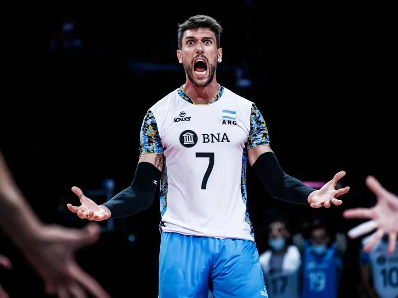 Facundo Conte celebrating in an Argentina men's national volleyball team uniform.