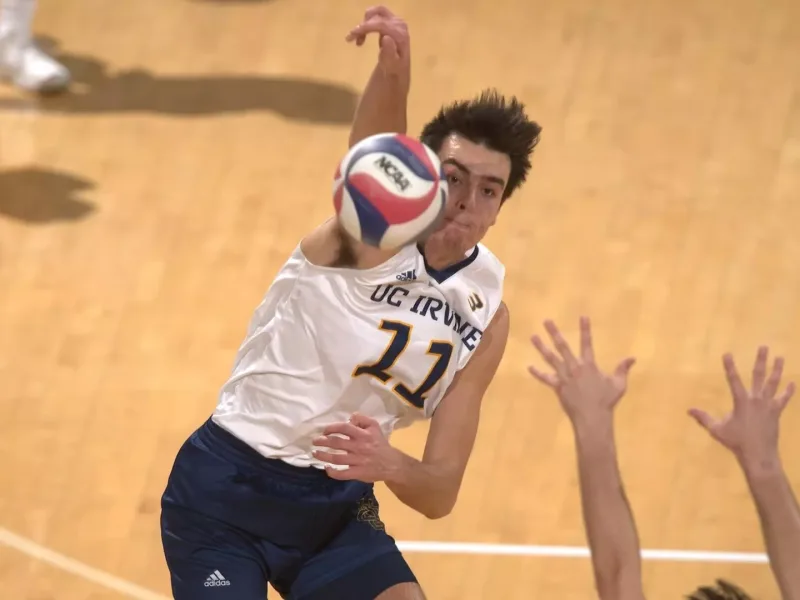Francesco Sani attacking for UC Irvine in NCAA volleyball.