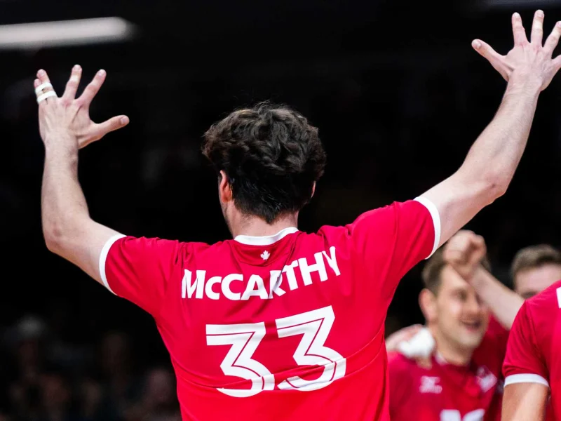 Fynn McCarthy celebrating with the Canada men’s national volleyball team
