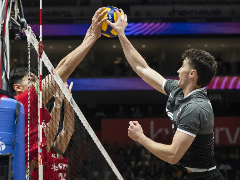 Jackson Young battling at the net for the Canada men’s national volleyball team