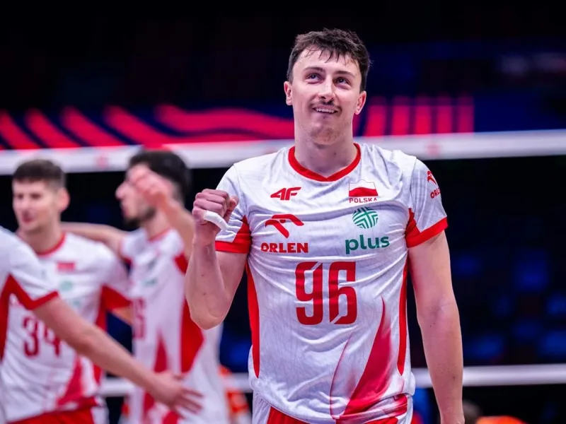 Jan Firlej celebrates a point with Poland during international volleyball.