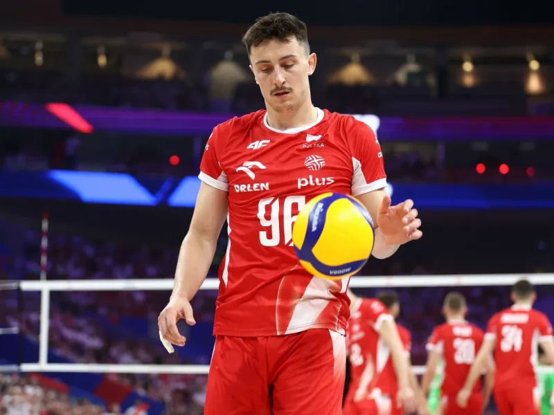 Jan Firlej serves for Poland during international volleyball.