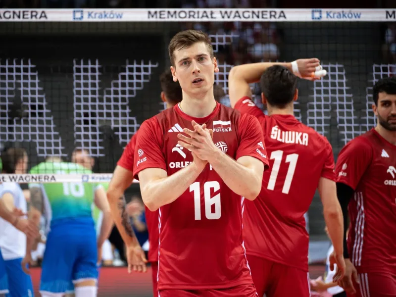 Kamil Semeniuk applauding for Poland at the Wagner Memorial.