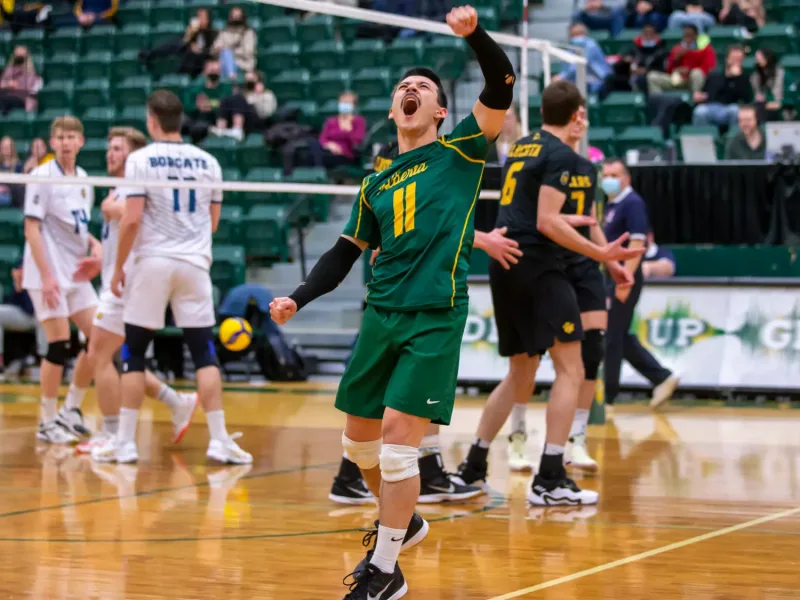 Landon Currie celebrating a point for the Alberta Golden Bears