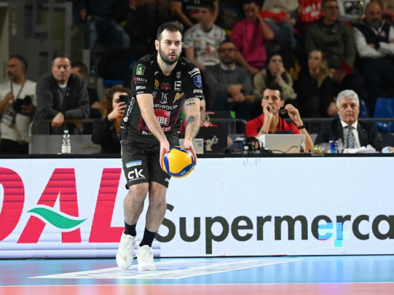 Luciano De Cecco prepares to serve during an Italian club volleyball match.