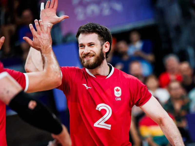 Luke Herr with teammates on the Canada men's national volleyball team.