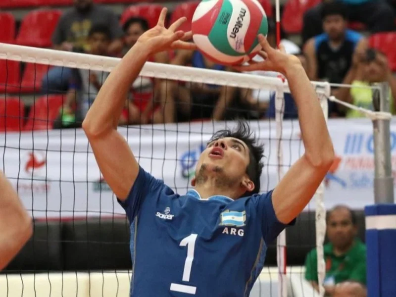 Matías Sánchez Pages raises both hands to set the ball for Argentina.