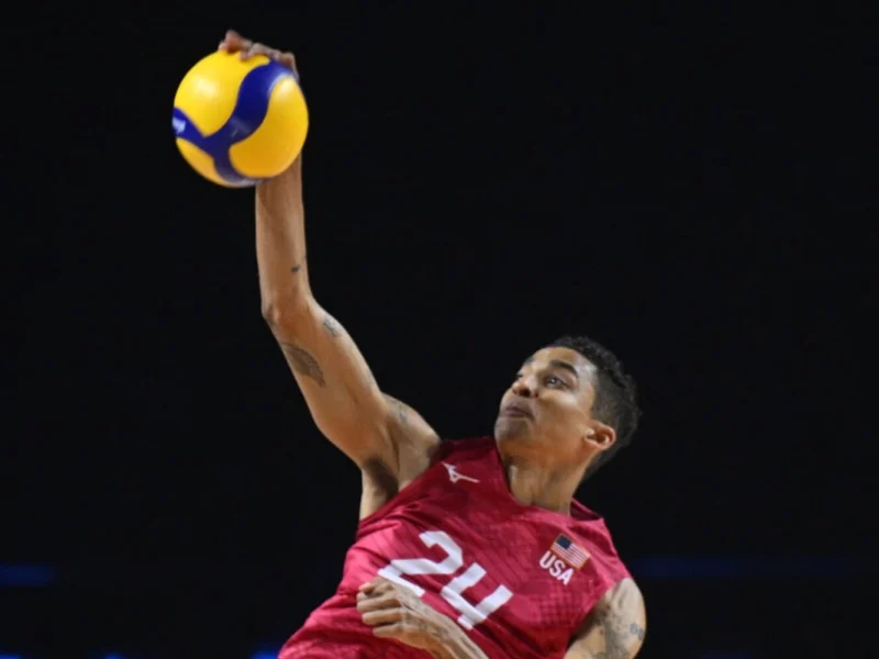 Merrick McHenry serving for the United States men's national volleyball team.