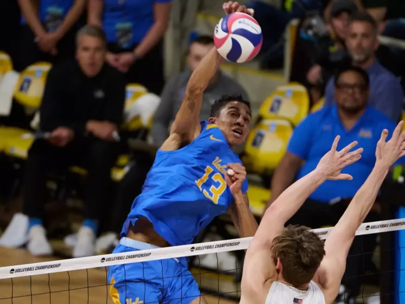 Merrick McHenry attacking for UCLA during the 2024 NCAA men's volleyball season.