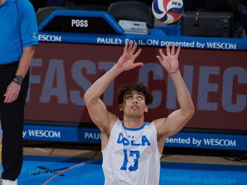 Micah Maʻa setting for UCLA during his college volleyball career