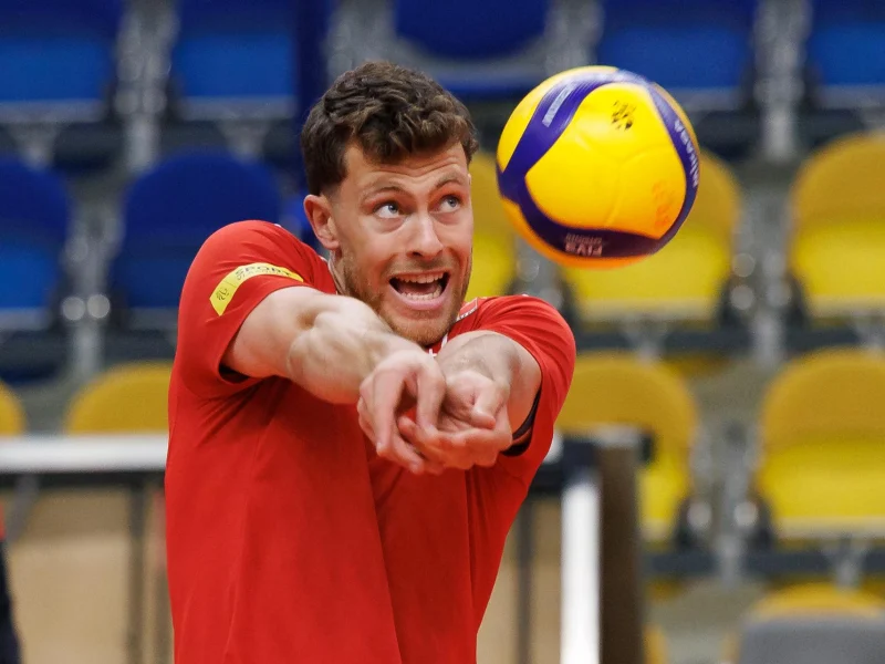 Seppe Van Hoyweghen receiving the ball in Belgium national team training kit.
