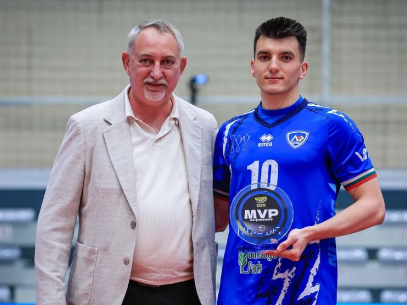 Stoil Palev holding an MVP award in a Levski Sofia jersey.