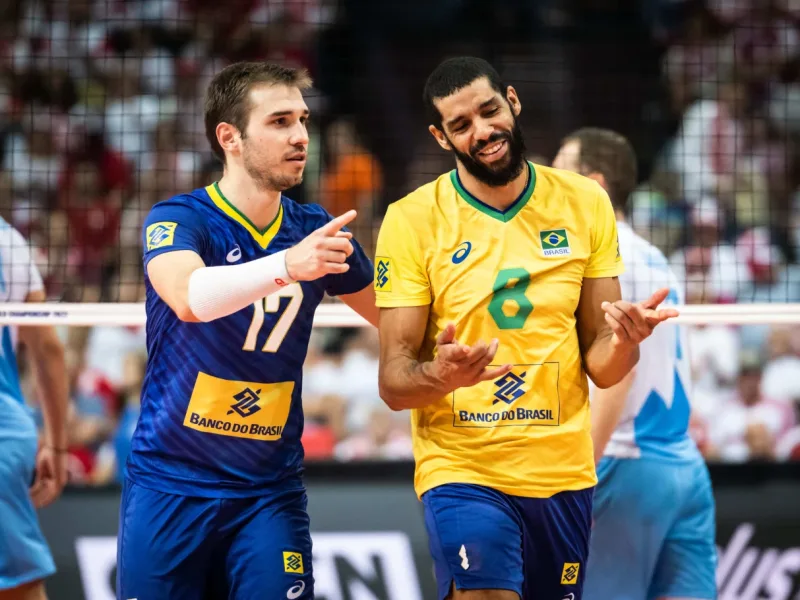 Thales Hoss in Brazil national team colors beside a teammate during an international match.