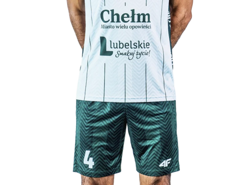 Yacine Louati wearing the white-and-green ChKS Chełm volleyball kit.